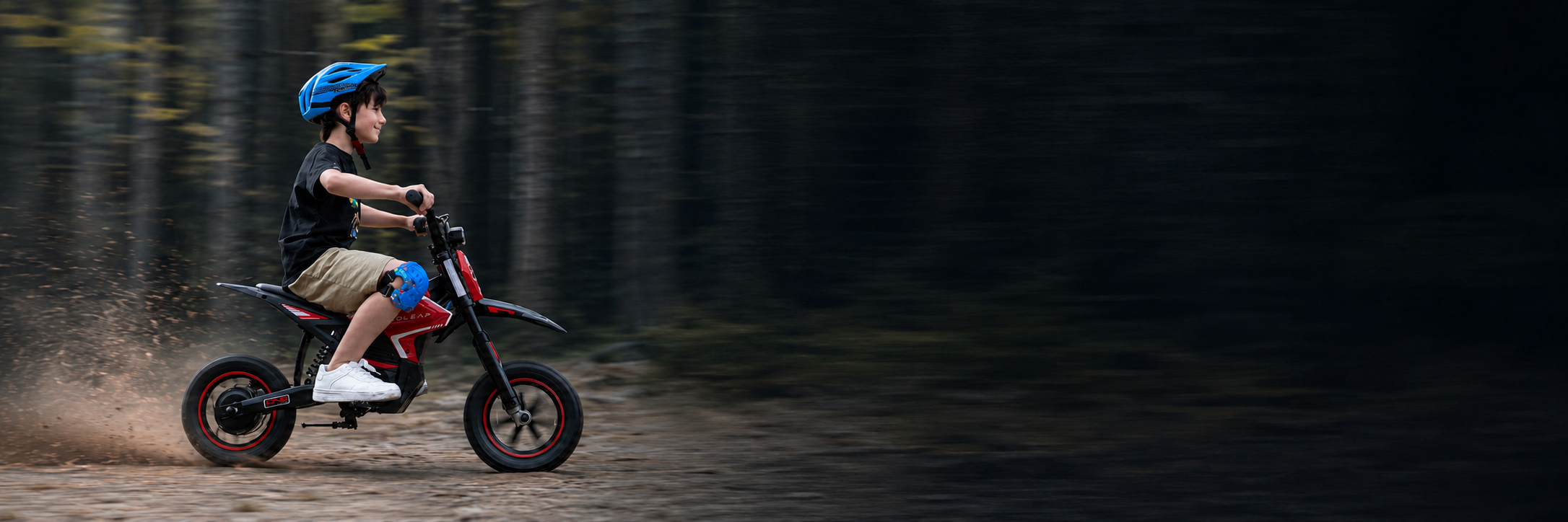 Young rider on the red Ecoleap K2 kids electric dirt bike